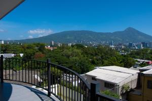 a view of a city from the balcony of a building at City Views Apartment in San Salvador