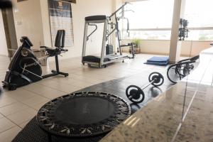 a fitness room with a gym with tread machines at Ibituruna Center Hotel in Governador Valadares