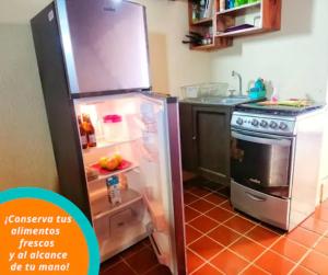 Virtuvė arba virtuvėlė apgyvendinimo įstaigoje Loft SOL Huatulco Excelentes precios y ubicación