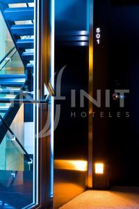 an open door to a building with a staircase at Hotel Inffinit in Vigo