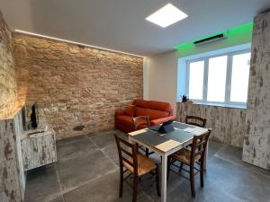 a living room with a table and a couch at Piano Terra in Ancona