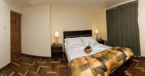 Ένα ή περισσότερα κρεβάτια σε δωμάτιο στο Hostal Samichay
