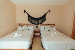 Postel nebo postele na pokoji v ubytování Hotel Casa Piedad