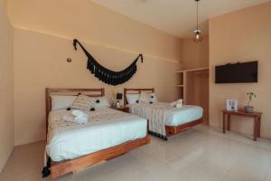Postel nebo postele na pokoji v ubytování Hotel Casa Piedad