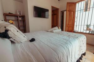 Postel nebo postele na pokoji v ubytování Hotel Casa Piedad