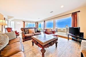a living room with a couch and a coffee table at Newport Beach Front View I in Newport Beach