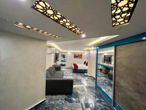 a living room with a couch and a table at Petra Sella Hotel in Wadi Musa
