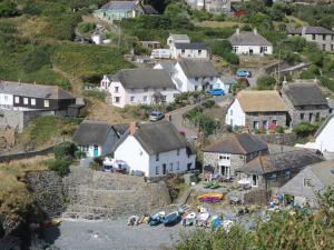 an aerial view of a village with houses and cars at Bryher Cottage in Helston