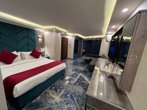 a hotel room with a bed and a bathroom at Petra Sella Hotel in Wadi Musa