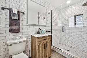 a bathroom with a toilet and a sink and a shower at The Historic West Walker Motel in Walker