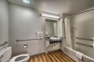 a bathroom with a toilet and a sink at Motel 6-Kerrville, TX in Kerrville +53 photos