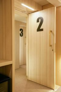 a hallway with a door with numbers on it at The Venice Nest @ Ca' Del Duca in Venice +10 photos