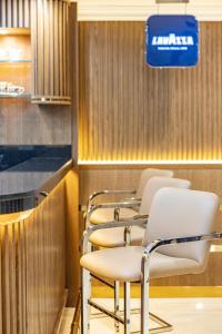a row of chairs in a waiting room at Golden Sands Suites in Dubai