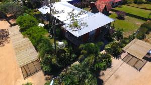 an overhead view of a building with palm trees at La Serena Suites Aparthotel in La Paloma