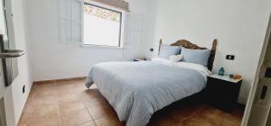 Postel nebo postele na pokoji v ubytování Apartamento Salema mar, relax y atardecer al norte de Gran Canaria