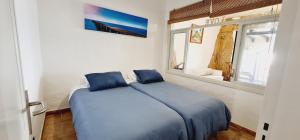 Postel nebo postele na pokoji v ubytování Apartamento Salema mar, relax y atardecer al norte de Gran Canaria