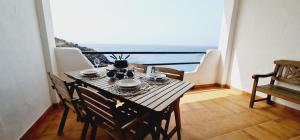 Posezení v ubytování Apartamento Salema mar, relax y atardecer al norte de Gran Canaria + 31 fotografií