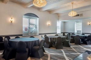 a room with tables and chairs and a window at Best Western Fort Washington Inn in Fort Washington