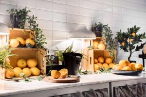 a bunch of oranges on a counter in a kitchen at Best Western Princess Hotel in Norrköping