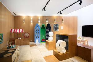 a living room with a tv and some sculptures at Best Western Princess Hotel in Norrköping +77 photos