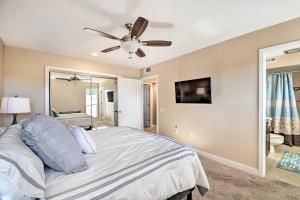 a bedroom with a bed and a ceiling fan at Quiet Sun City Home with Patio, Community Pool! in Sun City