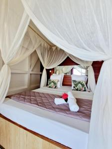 Postelja oz. postelje v sobi nastanitve Hotel Le Manguier + 37 fotografij