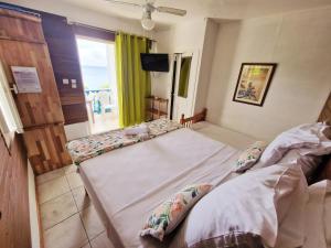 Postelja oz. postelje v sobi nastanitve Hotel Le Manguier