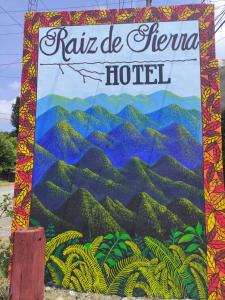 a sign for a hotel with a painting of mountains at Hotel Raíz de Sierra in Matlapa