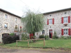 a stone building with a tree in front of it at Gîte Le Brignon, 3 pièces, 4 personnes - FR-1-582-177 in Le Brignon