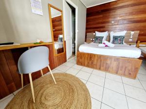 Postelja oz. postelje v sobi nastanitve Hotel Le Manguier
