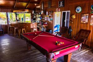 a pool table in the middle of a room at Blue Marlin Beach Resort in Dangriga