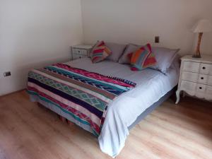 מיטה או מיטות בחדר ב-Aruma Codpa