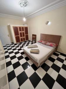 מיטה או מיטות בחדר ב-Très Propre Appartement 85 m2