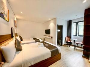 TV a/nebo společenská místnost v ubytování Carnival Hotel - Đà Lạt