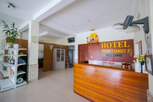 a hotel lobby with a hotel sign on the wall at Family Transit 2 Hotel in Hanoi