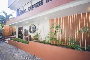 a building with plants on the side of it at Island Princess Resort Boracay, Station 2 in Boracay