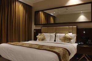 Mango Hotels Vijayawada客房内的一张或多张床位