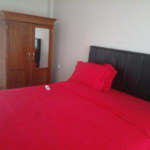 מיטה או מיטות בחדר ב-Hotel Lembunai