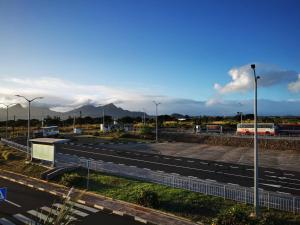 a highway with street lights on the side of a road at Résidence Oak in Petite Rivière