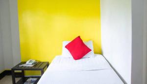 Postel nebo postele na pokoji v ubytování Negrense Suites