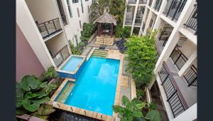 an overhead view of a swimming pool in a building at 3 Bedroom Central Beachside Kingscliff Apartment with Pool in Kingscliff