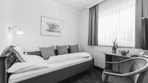 Ένα ή περισσότερα κρεβάτια σε δωμάτιο στο Hotel24Steps