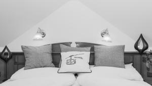 Ένα ή περισσότερα κρεβάτια σε δωμάτιο στο Hotel24Steps