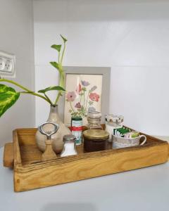a wooden shelf with vases and other items on it at בית פרומן in Moledet