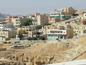 a view of a village on a mountain at Petra Guests home in Wadi Musa
