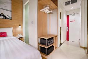 Postel nebo postele na pokoji v ubytování favehotel Palembang