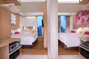 Postel nebo postele na pokoji v ubytování favehotel Palembang