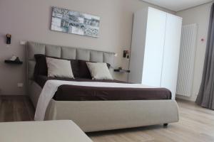 a bedroom with a large bed in a room at Le casette in Monopoli