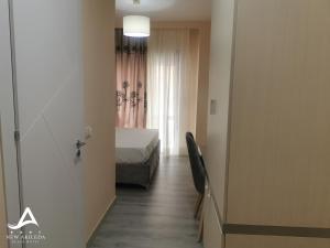 Postel nebo postele na pokoji v ubytování New Akileda Beach Hotel + 28 fotografií