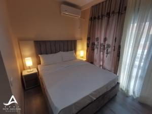 Postel nebo postele na pokoji v ubytování New Akileda Beach Hotel